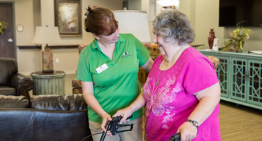 Cedar View resident assisted by friendly staff.